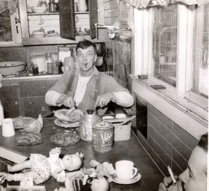 Jack Milligan carves the Easter ham in 1951